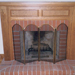 Oak mantel with red brick hearth